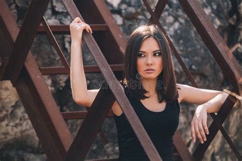 Portrait Of Fashion Model Girl On The Industrial Background Stock