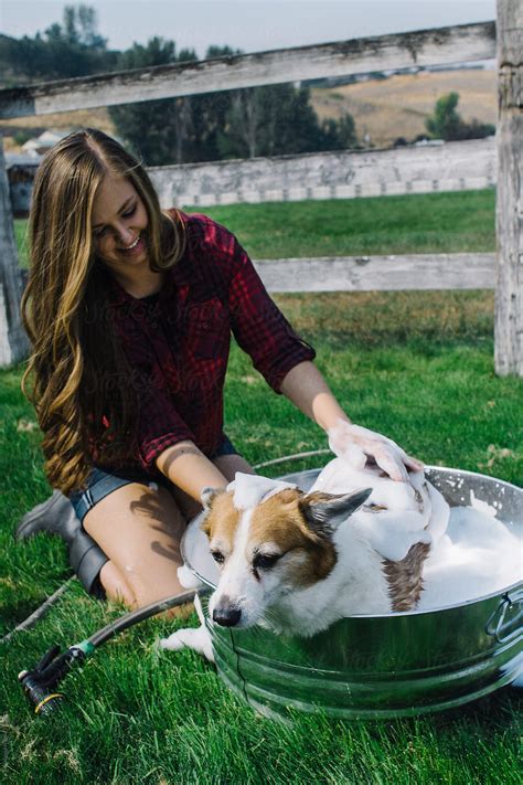 Teenager Giving Pet Dog Soapy Bath By Stocksy Contributor Tana Teel