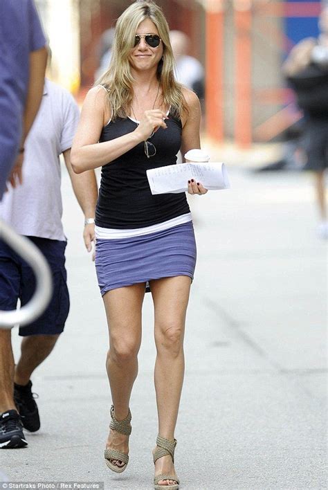 age defying jennifer aniston 44 proves you re never too old for a mini skirt as she shows off