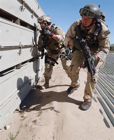 Us Navy Usn Seal Team Members Armed With A 556mm M4 Carbines