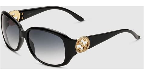 gucci elegant oval shaped sunglasses in black lyst