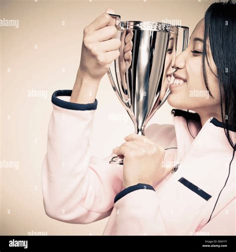 Mixed Race Woman Holding Trophy Stock Photo Alamy