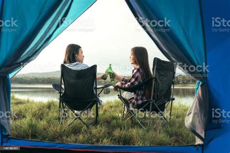 Asian Lgbtq Couples Drinking Drinks In A Romantic Atmosphere Inside A Camping Tent Lgbtq Couples