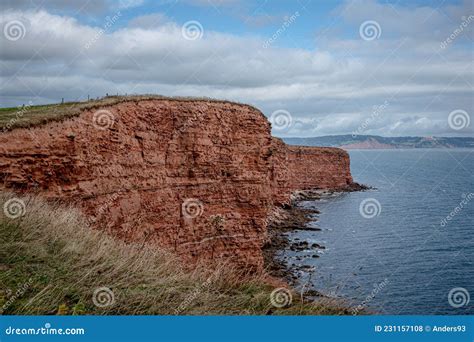 Red Otter Sandstone Cliffs At Danger Point Walking East From Otterton Ledge Devon Stock Photo
