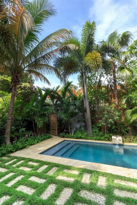 Tropical Swimming Pool With Palm Trees Best Swimming Pool Landscaping