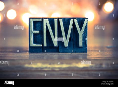The Word Envy Written In Vintage Metal Letterpress Type On A Soft