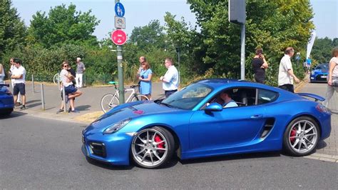 Two blue Porsches Cayman leaving Cars and Coffee Düsseldorf YouTube
