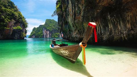 a boat through rocks andaman sea thailand wallpaper download 3840x2160
