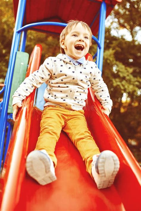 Little Boy Playing On Children S Slides Stock Photo Image Of