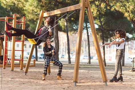 Girlfriends Having Fun On Playground By Stocksy Contributor Guille Faingold Stocksy