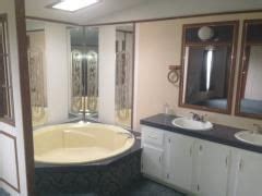 The mobile home bathroom design ideas around the edges it is equipped with baseboard molding that has an edge matching. Garden tub with double vanities 1992 Fleetwood Mobile ...