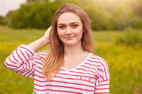 Close Up Shot Of Young Beautiful Caucasian Girl Dressed Striped Casual