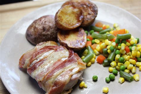 Pantry ingredients, finger lickin' good! Bacon Wrapped Pork Chops with Roasted Potatoes for Two ...