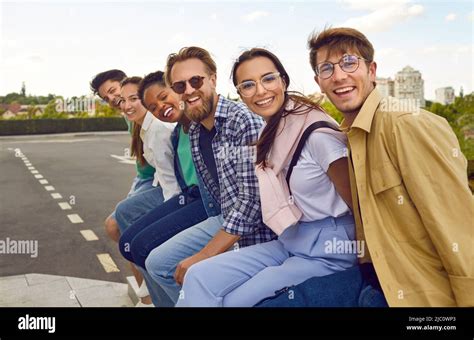 Group Portrait Of Cheerful Young Multiethnic Friends Having Fun In The