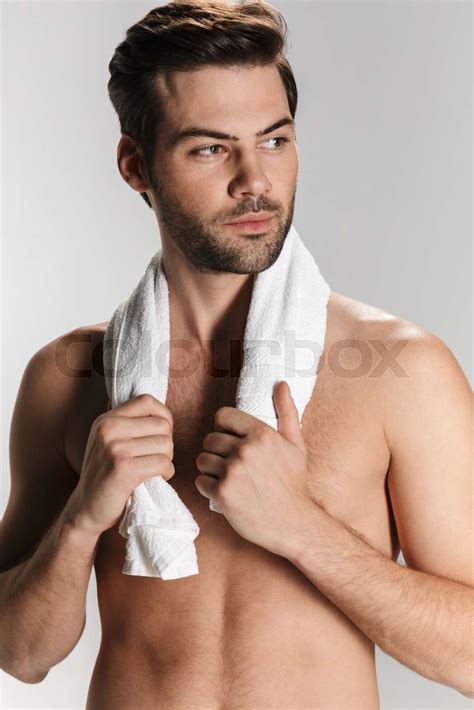 Photo Of Athletic Half Naked Man Posing With Towel And Looking Aside