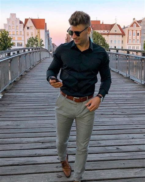 simple business casual combo inspiration with a black button up shirt sunglasses watch brown