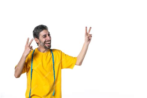 Free Photo Front View Of Smiling Young Guy In Yellow Shirt And