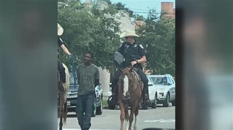 Texas Police Chief Apologizes After Photo Shows Mounted Officers Leading Handcuffed Suspect By