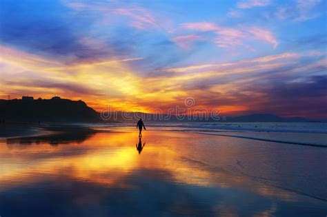 Man Walking On The Beach At Sunset Stock Image Image Of