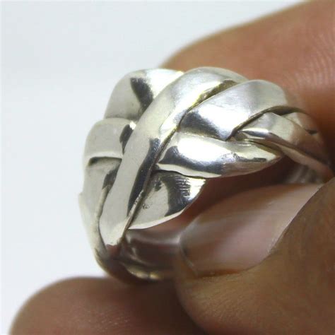 It is worn with a suit. 4 Band Puzzle ring for Men and Women in 925 sterling ...