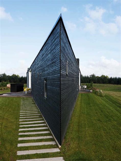 Architects h2l has completed the slit house on a triangular corner lot, located on a hilltop village nearby the city of guri, gyeonggi province, south korea. Triangular home in Denmark for a young and happy family