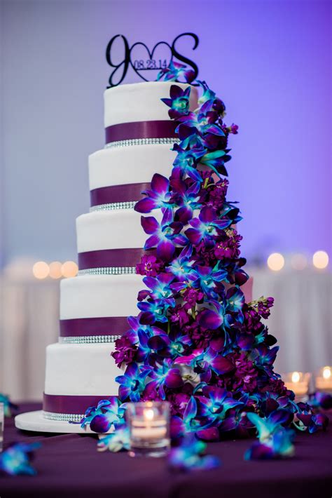 our wedding cake purple plum theme with dendrobium orchids dyed blue and a few lisianthus fi