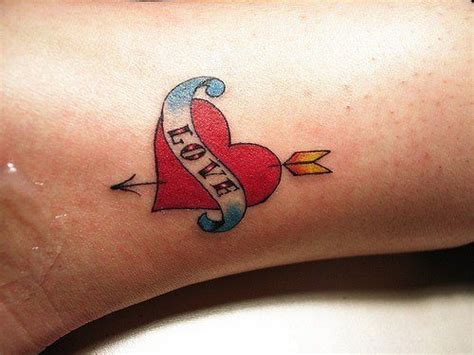 This Cute Love Tattoo Shows A Heart With Cupids Arrow