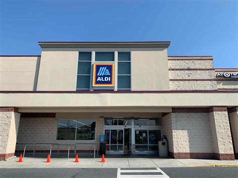 an aldi store front with orange cones in the foreground