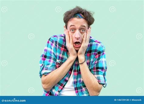 Unbelievable News Portrait Of Shocked Young Man In Casual Blue