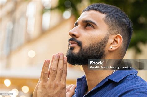 Portrait Of Indian Man Praying With Closed Eyes To God Asking For