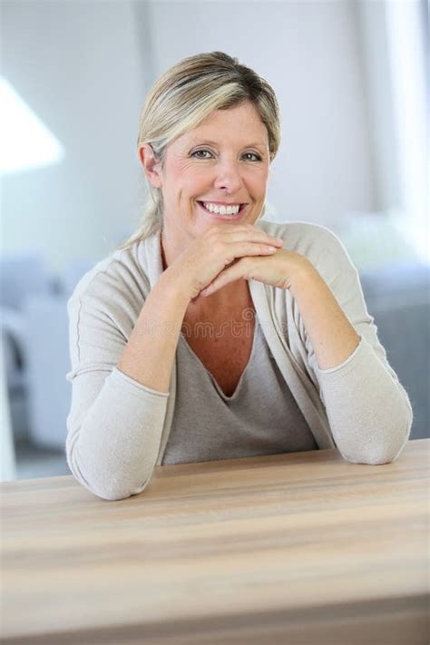 Smiling Mature Woman Sitting At Table Stock Image Image Of Middle