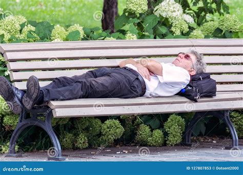 A Man Sleeps On A Bench Editorial Stock Photo Image Of Glasses