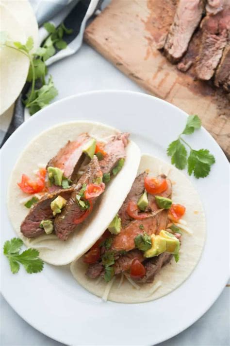 These flank steak tacos — seasoned with jalapenos, garlic, black pepper, lime and orange juices, and white vinegar — have a southwestern twist, according to recipe creator hannahmonster. EASY Flank Steak Tacos Recipe - Reluctant Entertainer