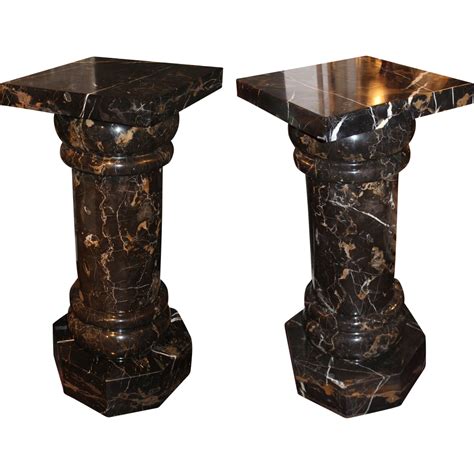 Pair Of Black Marble Pedestals Or Columns With Octagonal Bases Sold At