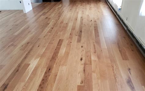 Our natural oak solid oak floating floor brings warmth and light to your home or office! White Oak Natural 5 inch - Michigan Plank Flooring