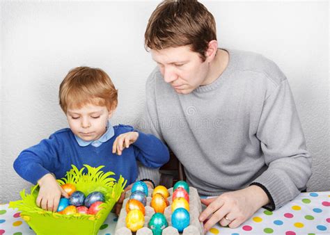 Little Boy And His Mother Being Happy About Selfmade Easter Eggs Stock