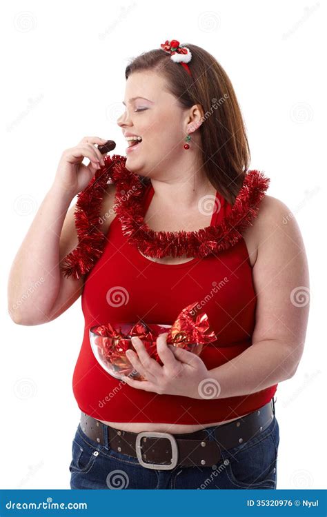 Fat Woman Eating Chocolate At Christmas Smiling Stock Photo Image Of