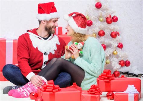 Couple In Love Enjoy Christmas Holiday Celebration Loving Woman And Bearded Man Wear Santa