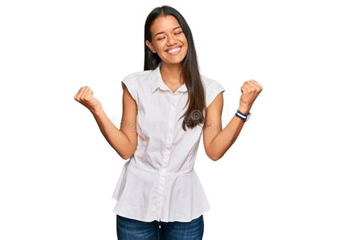 Beautiful Hispanic Woman Wearing Casual Clothes Very Happy And Excited Doing Winner Gesture With