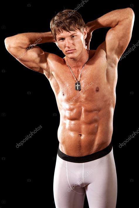 Male Bodybuilder Posing Studio Shot Over Black Stock Photo
