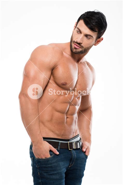 Portrait Of An Attractive Man With A Fit Physique Gazing Away On A White Backdrop Royalty Free
