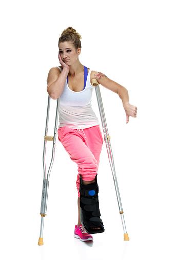 Sad Woman In Crutches Stock Photo Download Image Now