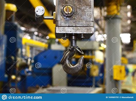 Crane Hook Of The Overhead Crane In The Workshop Of An Industrial Plant