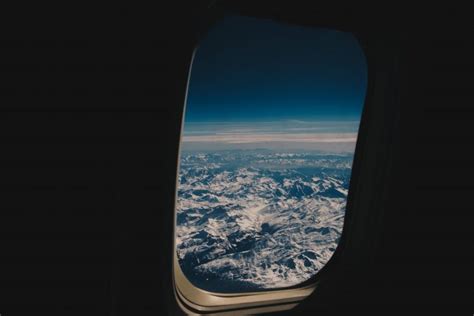 Airplane Mountains Flight Sky Clouds Window