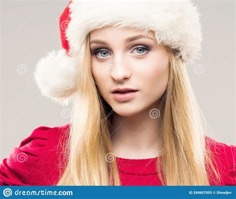 Portrait Of Young And Pretty Girl In Santa Hat New Year And Christmas
