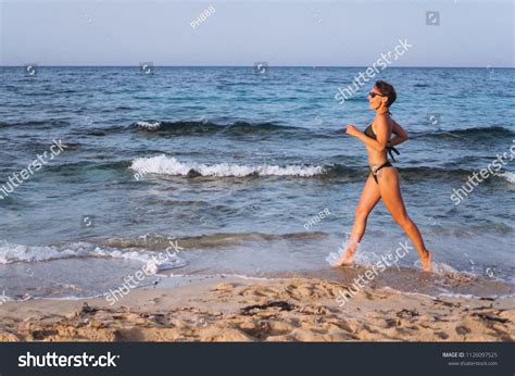 Woman Bikini Running On Sea Shore Stock Photo Shutterstock