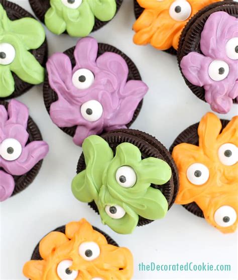 These black and white spiderweb cookies would look right at home at a chic halloween party. monster Oreos -- quick and easy Halloween party food idea