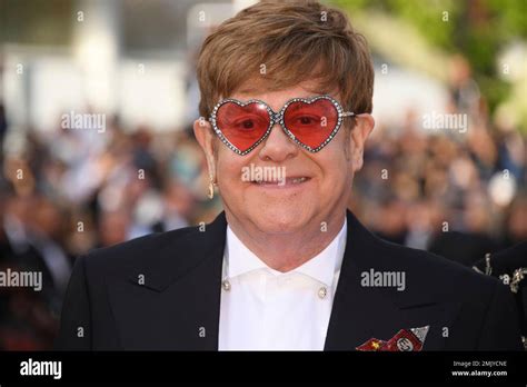Singer Elton John Poses For Photographers Upon Arrival At The Premiere Of The Film Rocketman