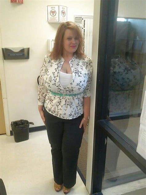 A Woman Is Standing In An Office Doorway