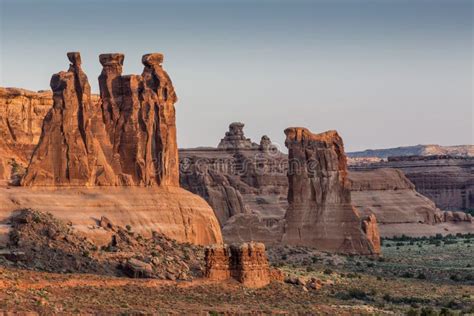 Three Gossips Rock Formation In Arches National Park At Sunrise Stock